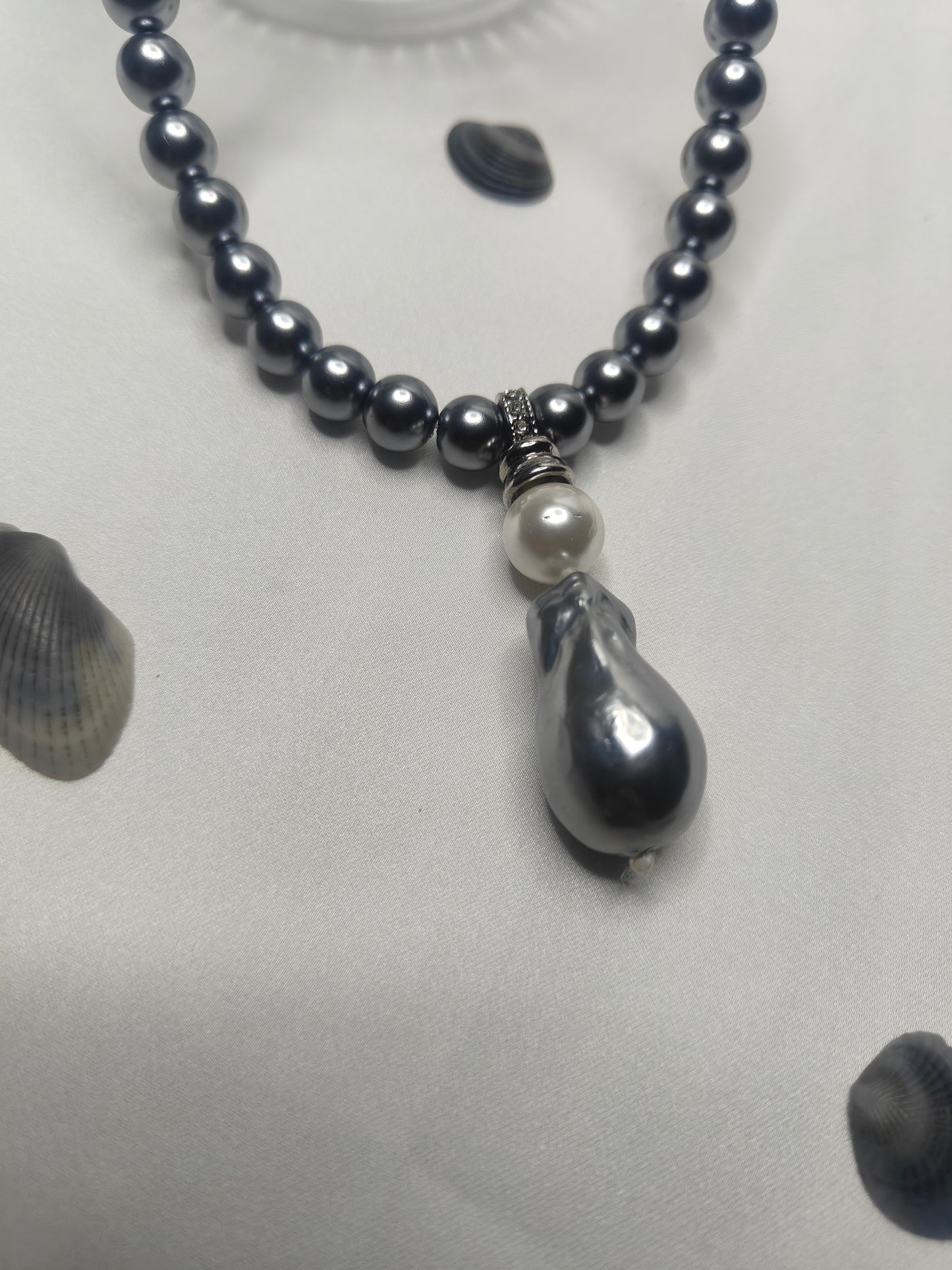 PSP006	Lunar Grace- Metallic grey single strand shell pearl necklace with Baroque pendant