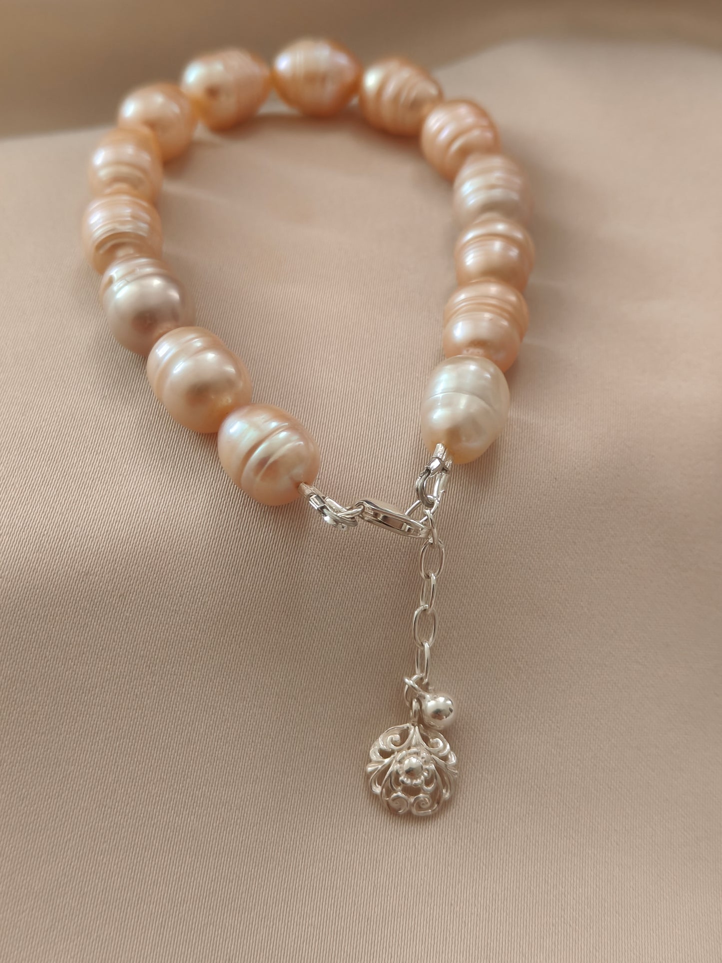 BRPFW002 Golden toned natural  ringed pearl bracelet with charm in sterling silver