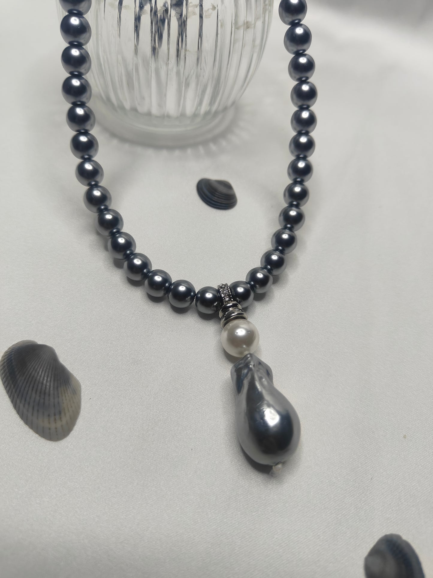 PSP006	Lunar Grace- Metallic grey single strand shell pearl necklace with Baroque pendant