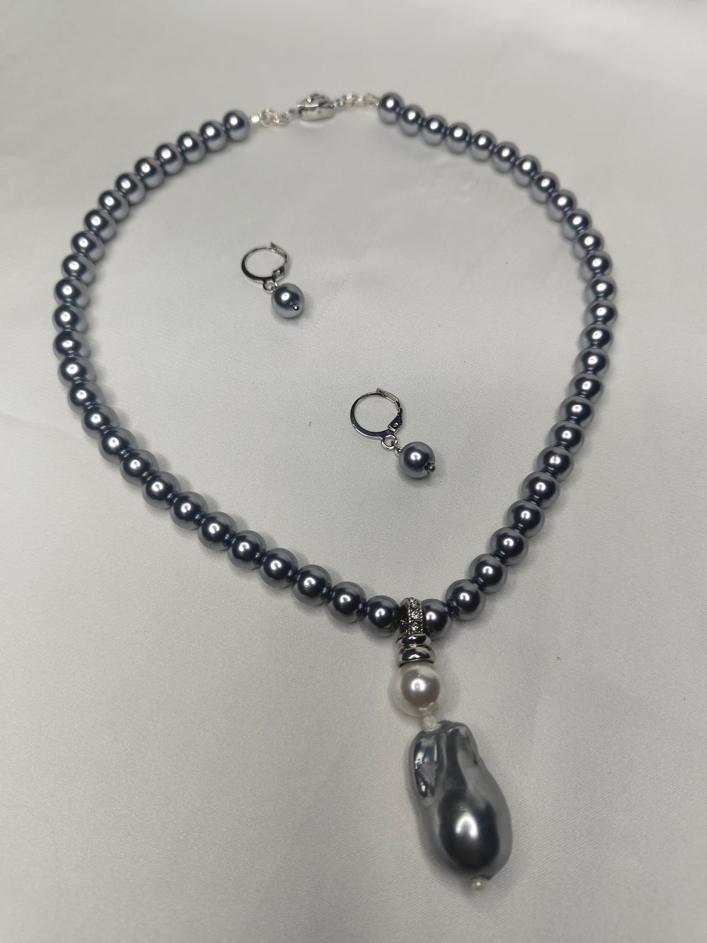 PSP006	Lunar Grace- Metallic grey single strand shell pearl necklace with Baroque pendant