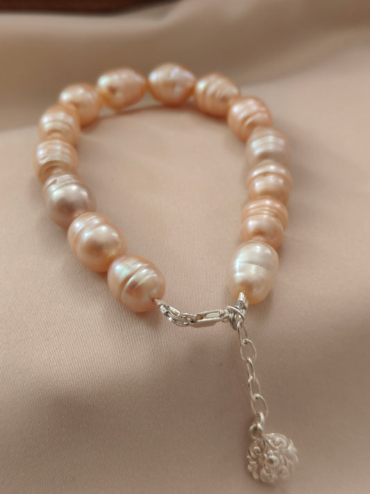 BRPFW002 Golden toned natural  ringed pearl bracelet with charm in sterling silver