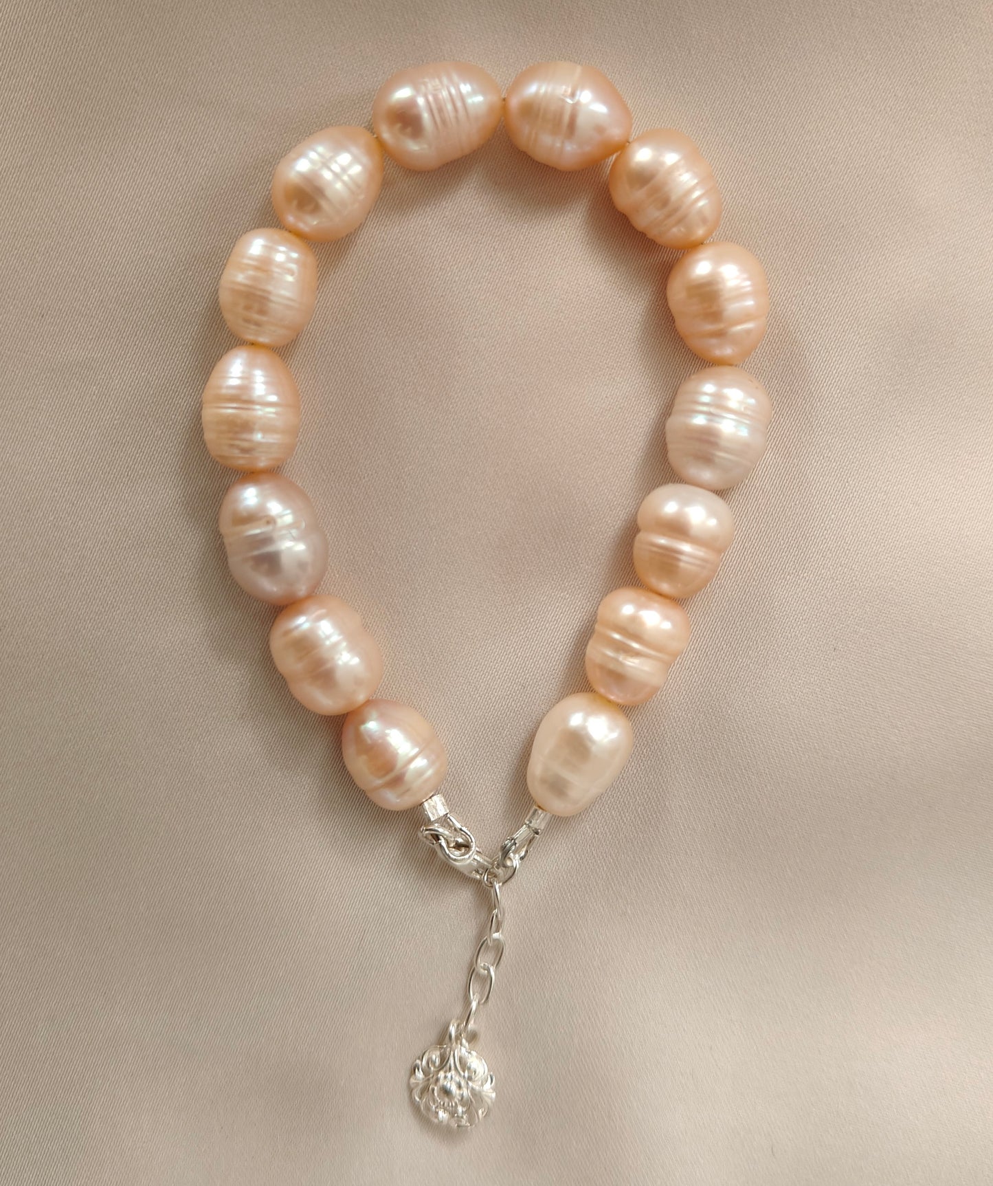 BRPFW002 Golden toned natural  ringed pearl bracelet with charm in sterling silver