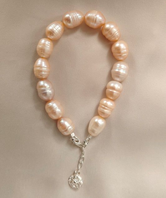 BRPFW002 Golden toned natural  ringed pearl bracelet with charm in sterling silver
